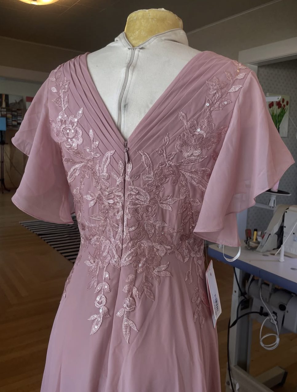 Dusty rose gown with lace applique and pleated back detail